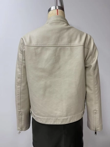 Back view of beige faux leather jacket featuring stand collar and metal zipper details