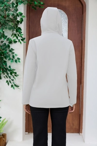 Rear view of a light grey hooded windbreaker with a functional drawstring hood design