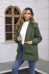 Detail of a dark green hooded windproof parka with large utility pockets and adjustable hood