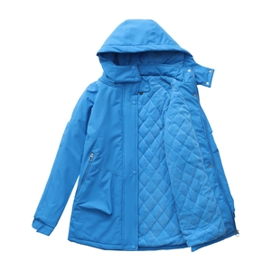 Detail view of bright blue hiking jacket featuring diamond quilted thermal lining and hood