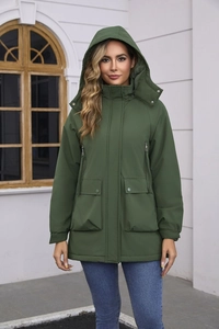 Detail of dark green waterproof parka featuring a detachable hood and utility pockets