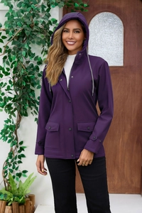 Detail view of purple waterproof jacket with adjustable drawstring hood and secure snap pockets