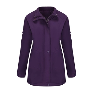 Detailed view of dark purple waterproof hiking jacket with zippered pockets and stand collar