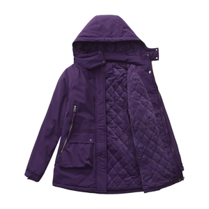 Detail of waterproof jacket featuring purple quilted fleece lining and zipper pocket