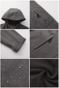 Detail view of water-resistant fabric, fleece lining and pockets on hooded jacket