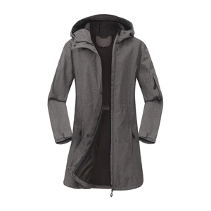 Detail of hooded outdoor jacket with functional sleeve pocket and textured grey fabric