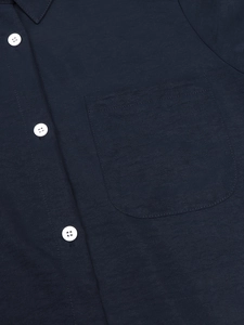 Navy blue linen shirt for women featuring white buttons and a single chest pocket