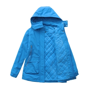 Close-up of blue water-repellent jacket with diamond quilted lining and zip pocket