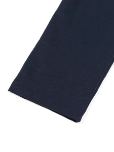 Detail view of the navy blue linen shirt cuff showing neat double-needle stitching quality