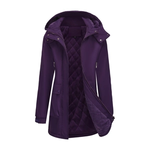 Macro detail of purple parka showing quilted diamond lining and secure metal snap buttons