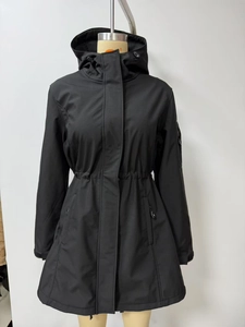 Front detail of women's black hooded parka with adjustable drawstring waist and pockets