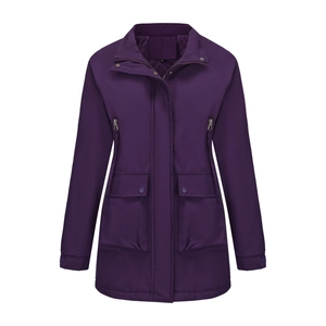 Detail of dark purple women's windbreaker featuring waterproof fabric and pocket accents