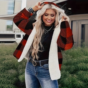 Detail of red buffalo plaid coat showing soft white faux shearling lining and texture