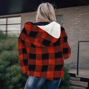 Detailed back view of a red and black plaid jacket with soft white sherpa lining inside the hood