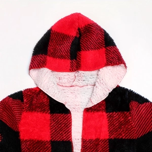 Detail of red and black plaid hoodie with soft white faux lamb wool lining texture