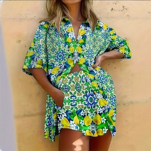 Detail of Mediterranean lemon and tile print on two-piece casual beach shirt and shorts set