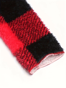 Detail of red and black plaid jacket with thick white fleece lining and soft plush texture