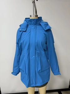 Detail view of the royal blue windproof hiking jacket with hood and flap pockets