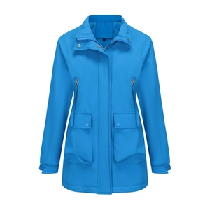 Close-up detail of electric blue outdoor parka with waterproof fabric and functional pockets