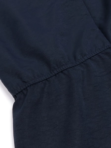 Deep blue sleeveless cotton linen jumpsuit with detailed waist stitching and fabric texture