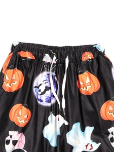 Women's Halloween pants with pumpkin print, elastic waistband and drawstring detail