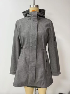 Detail of grey hooded softshell jacket showing arm zipper pocket and adjustable velcro cuff