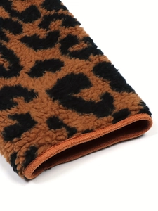 Close-up of leopard print faux fur jacket showing thick plush texture and stitching