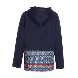 Close-up of navy quilted hoodie with vibrant ethnic geometric pattern on the back hem