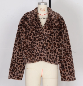 Close-up detail of soft faux fur texture and leopard print pattern on the winter jacket