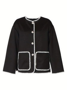Women's black boxy jacket with white scalloped stitching and pearl buttons detail