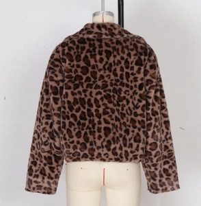 Rear view of cropped faux fur jacket featuring classic leopard print and relaxed fit