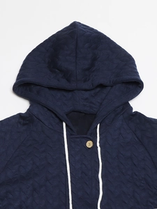 Women's dark blue hooded quilted jacket with floral patchwork and wooden button detail