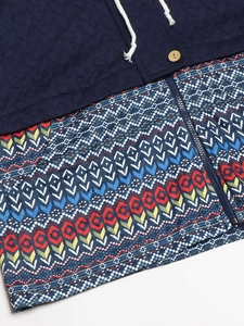 Women's quilted hooded jacket with navy blue fabric and ethnic patchwork print details