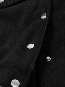 Macro view of black corduroy fabric texture and silver metal snap button on jacket