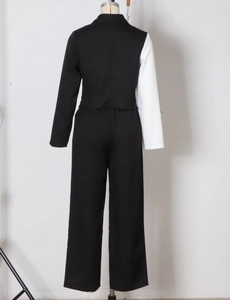 Back view of a chic black and white contrast two-piece blazer suit with wide-leg pants