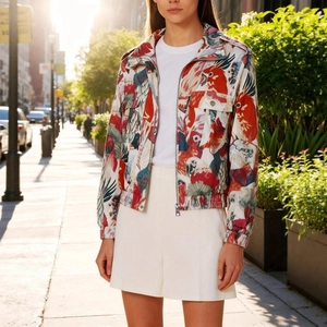 Detail of artistic parrot print jacket with metal zipper and front chest pockets
