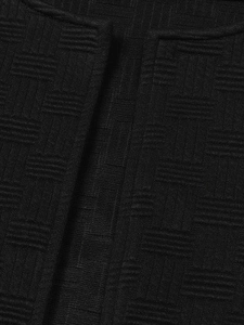 Close-up of black knitted jacket with a premium 3D waffle texture and seamless edge finishing