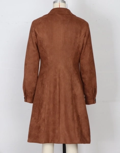 Detail view of the slim fit back design and suede texture of the brown long trench coat