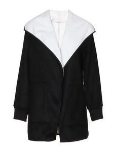 Relaxed black and white lamb wool jacket with contrast hood and ribbed cuffs