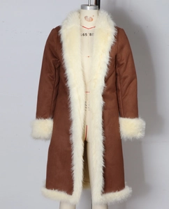 Detail of a brown suede winter coat on a mannequin featuring thick white faux fur trim