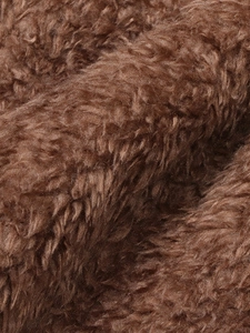 Brown teddy fleece fabric close-up showing soft thick texture of long sleeve cardigan