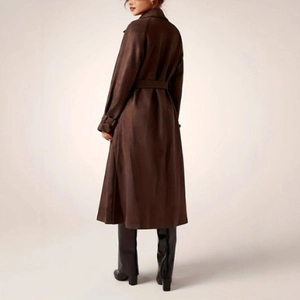 Detail view of brown long trench coat with waist belt and adjustable cuff straps