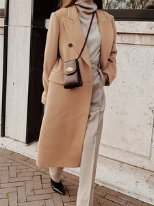 Classic double-breasted camel wool coat with notched lapels in a slim fit autumn style