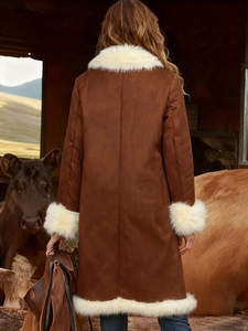 Brown suede long coat with white faux fur trim in a rustic farm setting for women