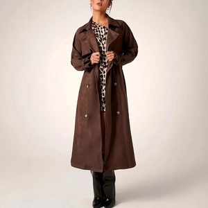 Detail of vintage brown long double-breasted trench coat with soft matte suede texture