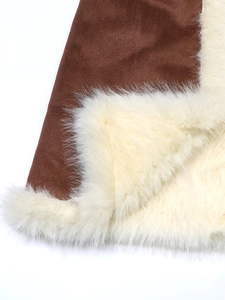 Close-up of brown suede coat with thick warm cream faux fur lining and stitching details