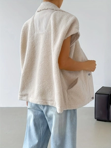 Cream wool vest for women featuring a warm lapel and stylish back patchwork design