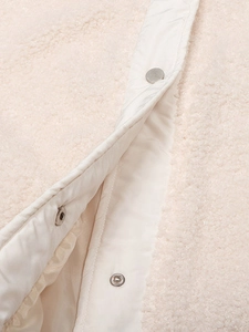 Women's warm sherpa vest with cozy fleece texture and silver snap button closure