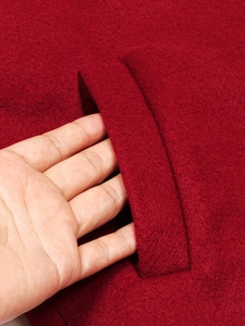 Deep red wool coat with functional side pockets and premium dense texture wool fabric