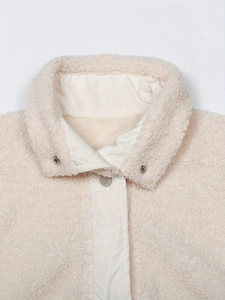Women's warm sherpa fleece vest with stylish metal snap collar and soft beige texture